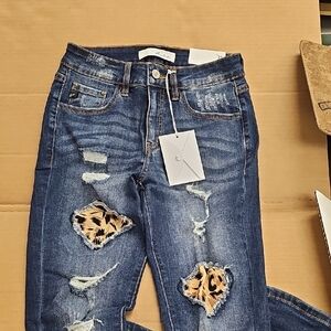Women's Distressed Blue Jeans with Leopard Print Accents